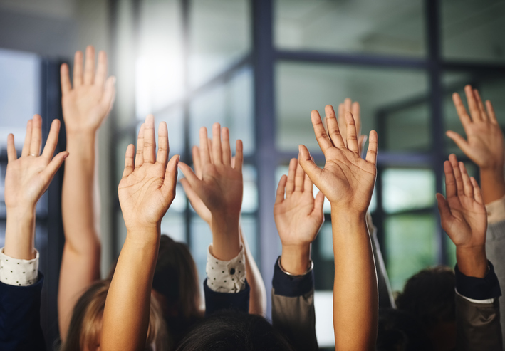 group raising hands